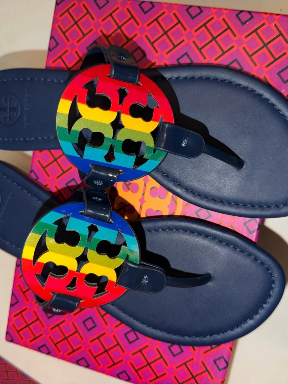 Tory Burch Navy Flip Flops with Rainbow Logo Medallions
